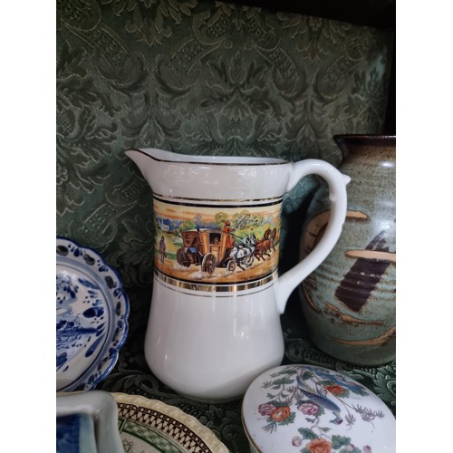 3 - A shelf full of collectable ceramics including a good unusual studio pottery glazed terracotta plate... 