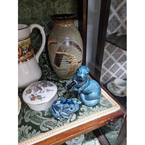 3 - A shelf full of collectable ceramics including a good unusual studio pottery glazed terracotta plate... 