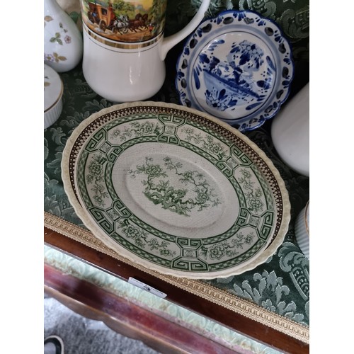 3 - A shelf full of collectable ceramics including a good unusual studio pottery glazed terracotta plate... 