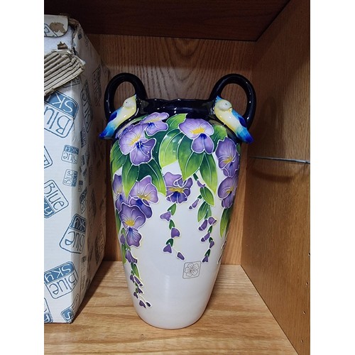 9 - A good quality blue sky pottery 2009 urn/vase with hand painted floral design with bird decoration o... 