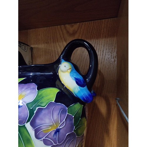 9 - A good quality blue sky pottery 2009 urn/vase with hand painted floral design with bird decoration o... 