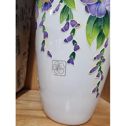 9 - A good quality blue sky pottery 2009 urn/vase with hand painted floral design with bird decoration o... 