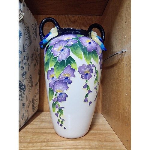 9 - A good quality blue sky pottery 2009 urn/vase with hand painted floral design with bird decoration o... 