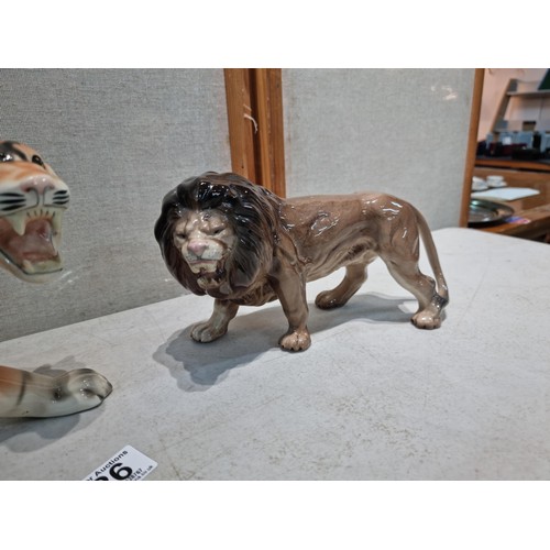 26 - 2 good quality Melbaware figurines including a lion and a tiger, both are stamped Melbaware undernea... 