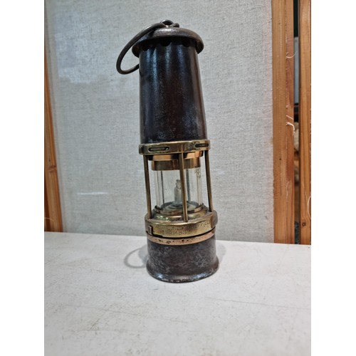 27 - A good quality antique miners lamp stamped 