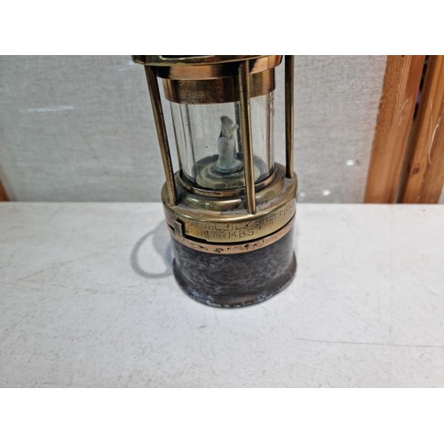 27 - A good quality antique miners lamp stamped 