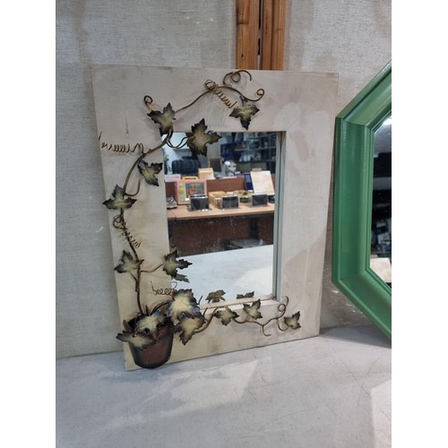 34 - 2 wooden framed mirrors, 1 with a wrought iron ivy design and 1 in an octagonal design, in green. Bo... 