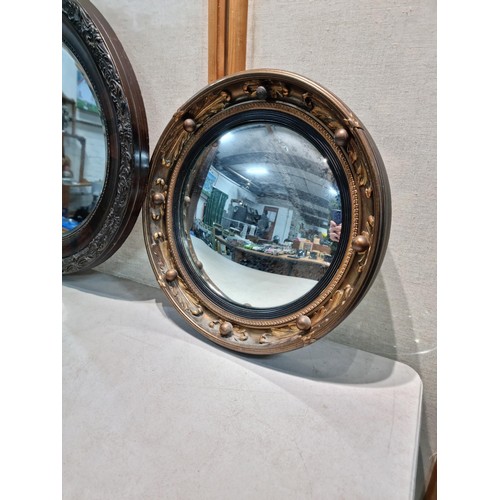 40 - 2 ornate mirrors, 1 in an oval frame with a carved edge and bevel edged along with a port hole mirro... 