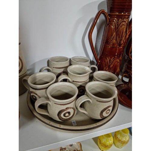 42 - Beswick Zorba coffee set with coffee pot etc along with another studio pottery earthenware coffee se... 