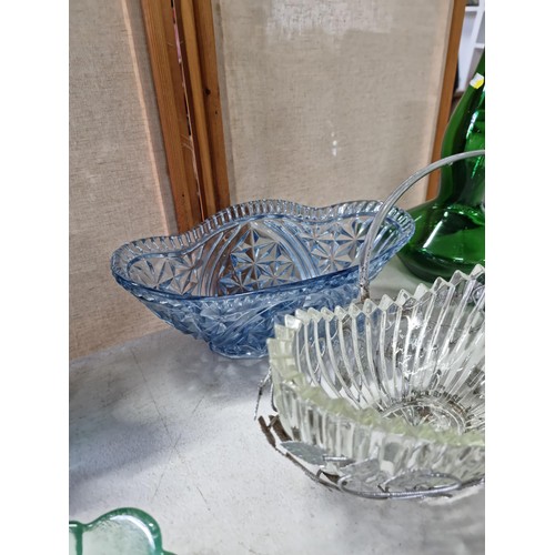 48 - A quantity of collectable glassware including 2 pressed glass fruit bowls, 1 in a stainless steel ba... 