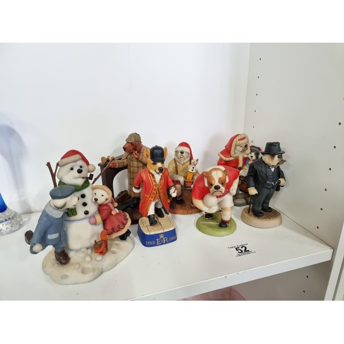 52 - A collection of 7 dog formed novelty figurines Doggie People including a Welsh Corgi Royal groom, a ... 