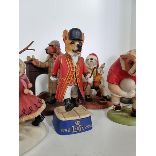 52 - A collection of 7 dog formed novelty figurines Doggie People including a Welsh Corgi Royal groom, a ... 