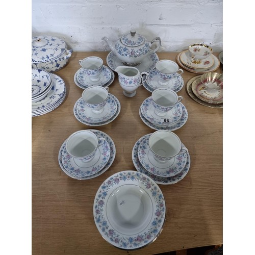 55 - A 26 piece Wawel Poland tea set complete with teapot, 6 trios, milk jug and 5 dishes in a blue and p... 