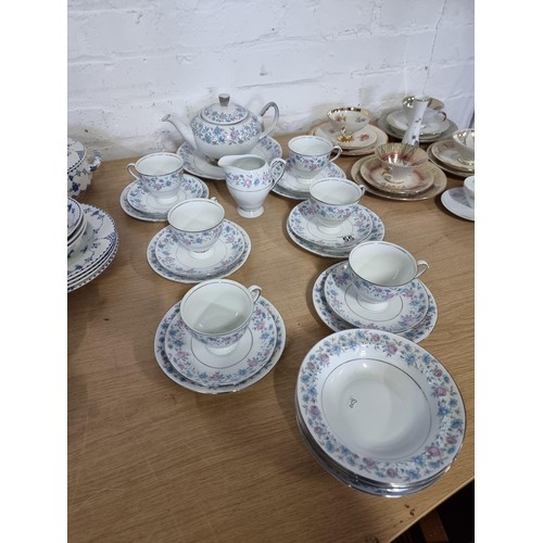 55 - A 26 piece Wawel Poland tea set complete with teapot, 6 trios, milk jug and 5 dishes in a blue and p... 