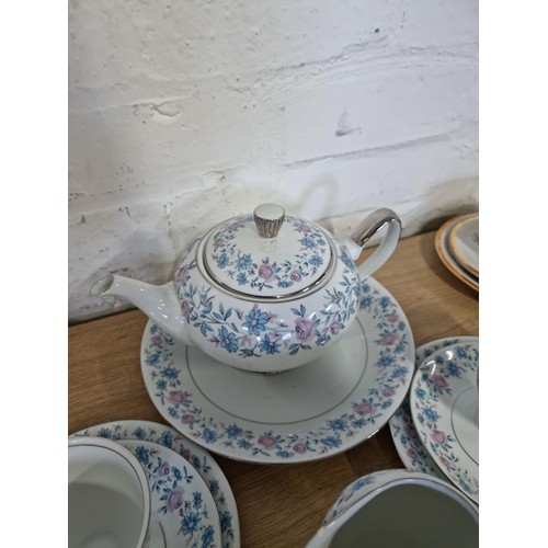 55 - A 26 piece Wawel Poland tea set complete with teapot, 6 trios, milk jug and 5 dishes in a blue and p... 