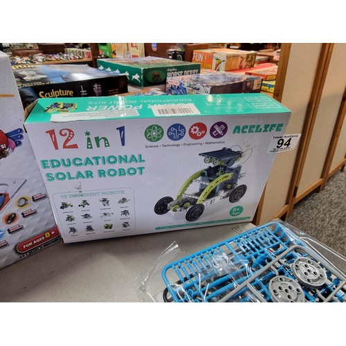 94 - A quantity of 4 boxed modern games to include a microscope set by Dynasun, 2x Solar robot instructio... 