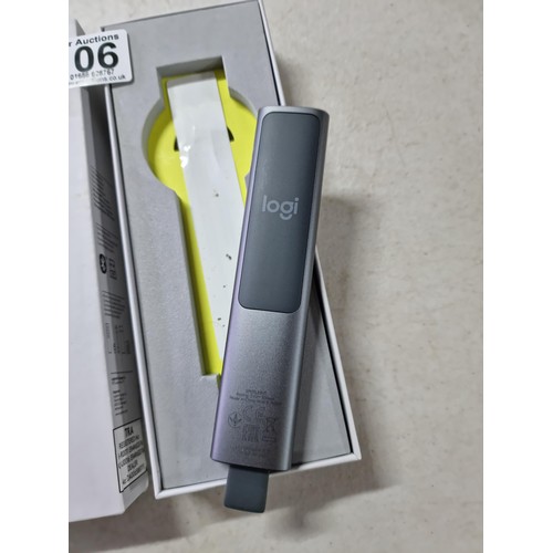 106 - A boxed spotlight presentation remote by Logitech, this wireless pointer is designed for effortlessl... 