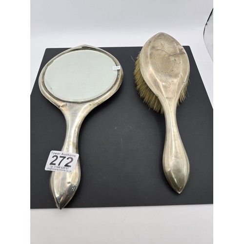 272 - An antique heavy duty hallmarked silver backed dressing table mirror and brush having an engraved de... 