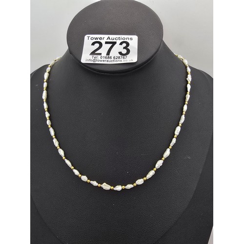 273 - A hallmarked 9ct yellow gold and natural pearl beaded necklace featuring pearl beads and 9ct gold be... 