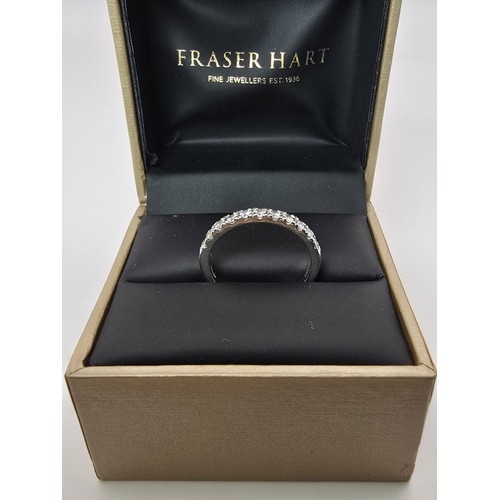 288 - A fine quality hallmarked 950 platinum diamond ring inset with 11 diamonds which are very sparkly an... 