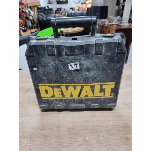 377 - A cased Dewalt DW981 battery powered drill along with spare battery and charger, in good order