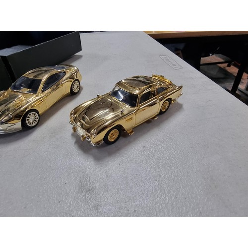 102A - 3x good quality diecast vehicle sets to include a Corgi 007 40th anniversary, 24ct gold plated 2 car... 