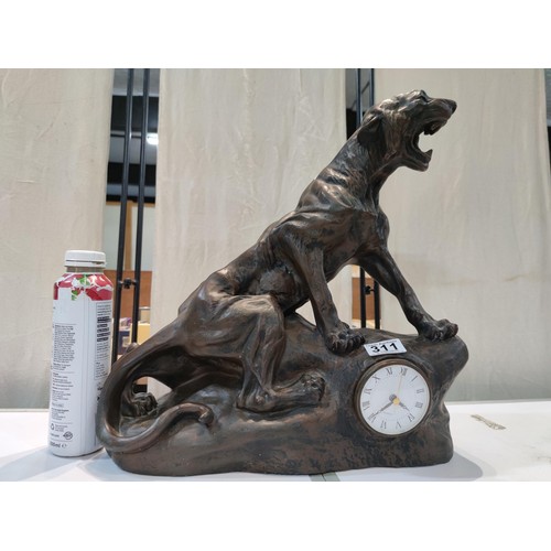 311 - A very large and impressive fibreglass figural clock in the form of a jaguar sitting on a rock featu... 