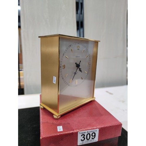 309 - A very good quality brushed brass cased quartz desk clock by Garrard (1 of the finest clock makers),... 