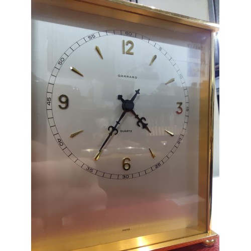 309 - A very good quality brushed brass cased quartz desk clock by Garrard (1 of the finest clock makers),... 