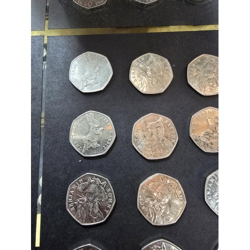 265 - A large collection of 21x collectable 50 pence coins all relating to the Beatrix Potter series to in... 