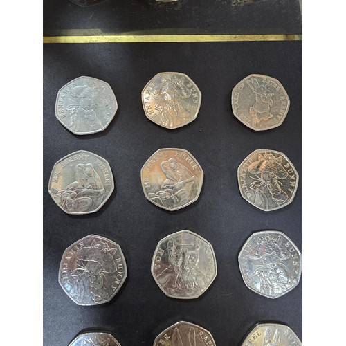 265 - A large collection of 21x collectable 50 pence coins all relating to the Beatrix Potter series to in... 