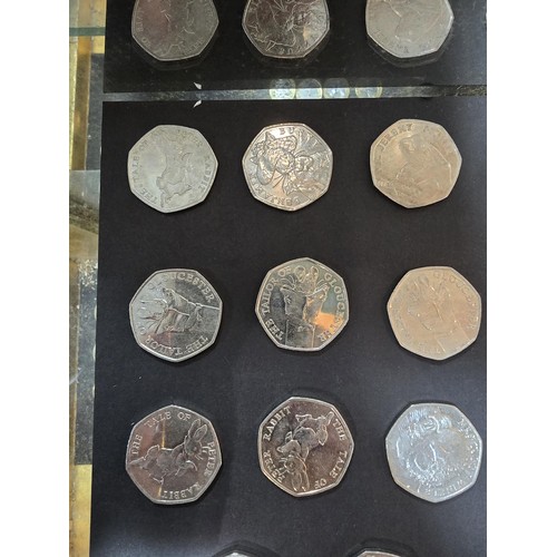 267 - A large collection of 19x collectable 50 pence coins, all are related to the Beatrix Potter series w... 