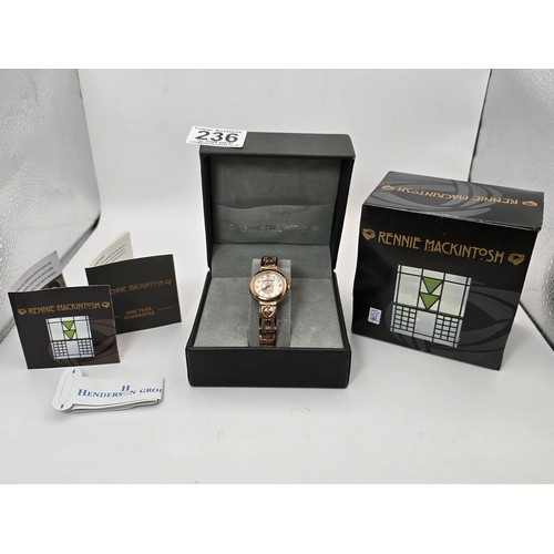 236 - An as new Rennie Mackintosh ladies quartz watch with a rose gold tone strap and case featuring a cla... 