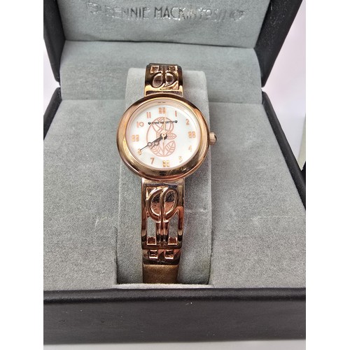 236 - An as new Rennie Mackintosh ladies quartz watch with a rose gold tone strap and case featuring a cla... 