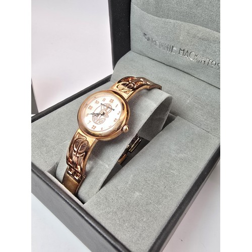 236 - An as new Rennie Mackintosh ladies quartz watch with a rose gold tone strap and case featuring a cla... 