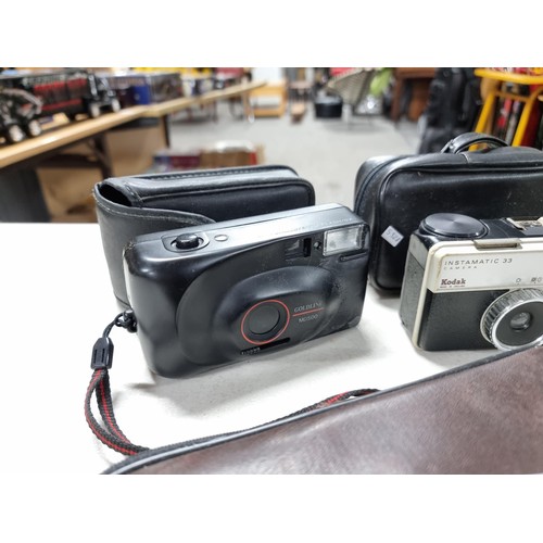 4 - Shelf containing a collection of cameras inc a Brownie 127, 2x Kodak Instamatic cameras, red Haminex... 