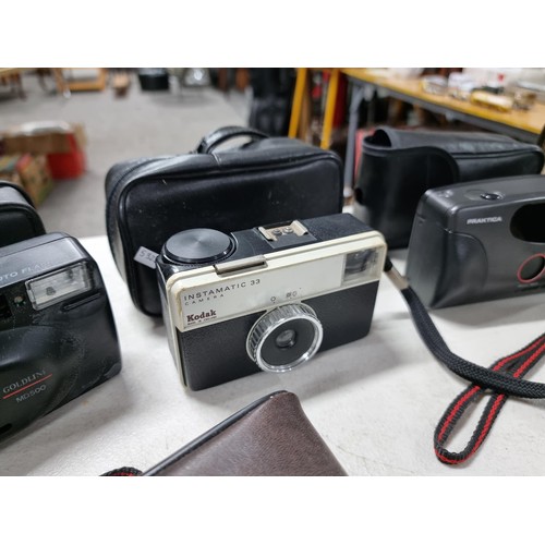 4 - Shelf containing a collection of cameras inc a Brownie 127, 2x Kodak Instamatic cameras, red Haminex... 