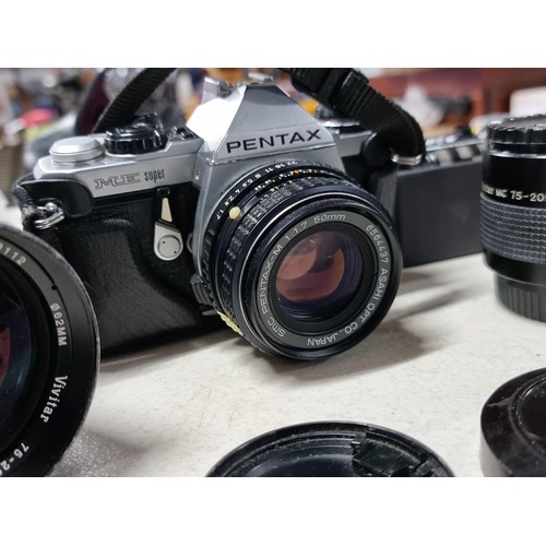 6 - Pentax ME Super with standard lens 50mm, a wide angle lens and a variable tele photo lens 75/205, Vi... 