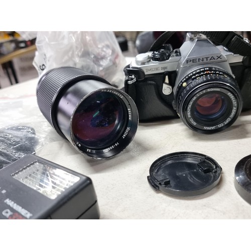 6 - Pentax ME Super with standard lens 50mm, a wide angle lens and a variable tele photo lens 75/205, Vi... 