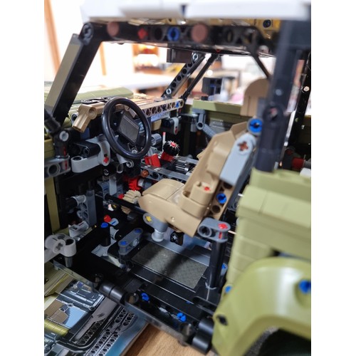 56 - Good quality hand built Lego style Land Rover Defender, complete with steering, independent suspensi... 