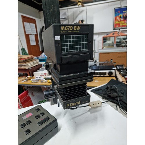 10 - A Durst M670 VW enlarger complete with lens and 35mm film carrier in working order along with a Durs... 