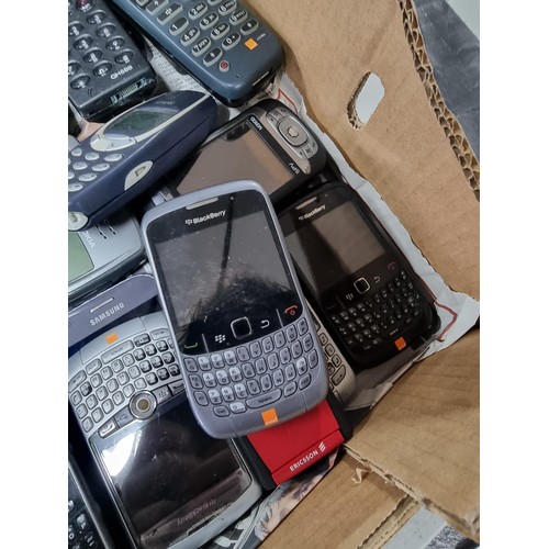 11 - A box containing a large quantity of mobile hones of various brands including blackberry Ericsson, N... 