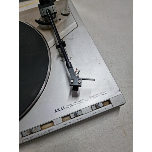 14 - An Akai model AP-Q310 Quartz full auto turntable, complete with stylus and rubber mat, in overall go... 