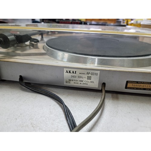 14 - An Akai model AP-Q310 Quartz full auto turntable, complete with stylus and rubber mat, in overall go... 