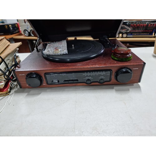 16 - A stereo turntable with built in radio, play 33's, 45's and 78's with built in amplifier and 2 speak... 