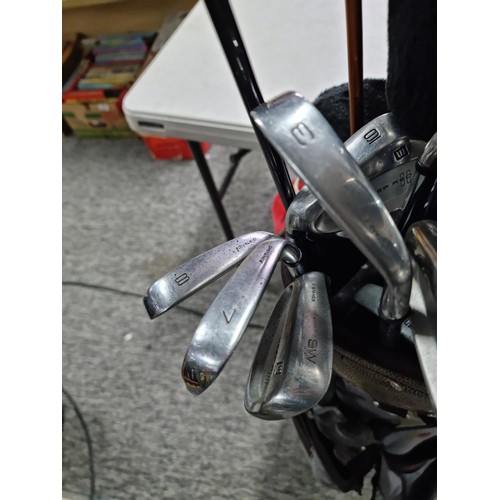 28A - A large golf set containing 12 woods of various brands, 9 irons and 2 putters including the brands D... 