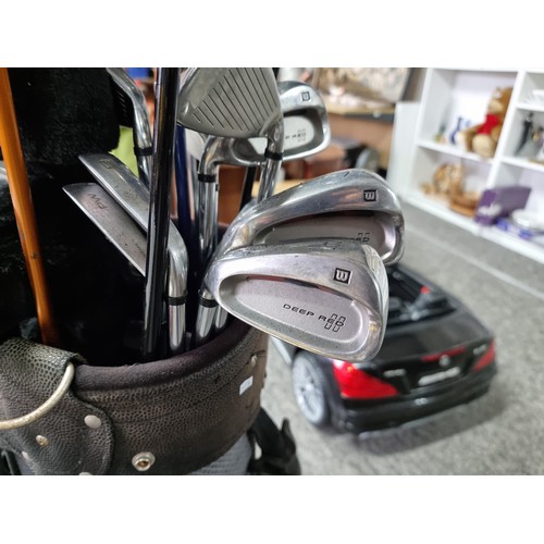 28A - A large golf set containing 12 woods of various brands, 9 irons and 2 putters including the brands D... 