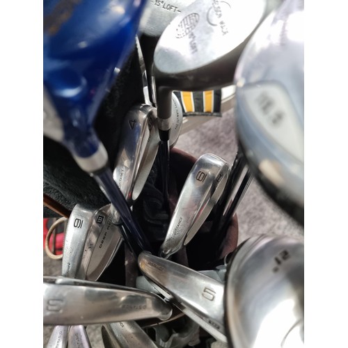 28A - A large golf set containing 12 woods of various brands, 9 irons and 2 putters including the brands D... 