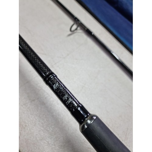 29 - A 12ft Matt Hayes fishing rod in a canvas bag made of carbon fibre in 2 parts and in overall good co... 