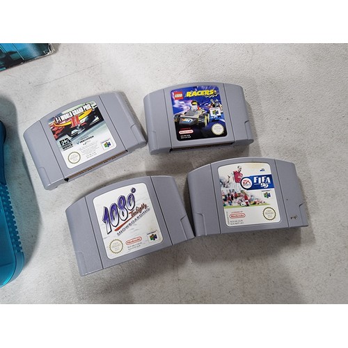 42 - A boxed Nintendo 64 limited edition clear blue with a selection of games.